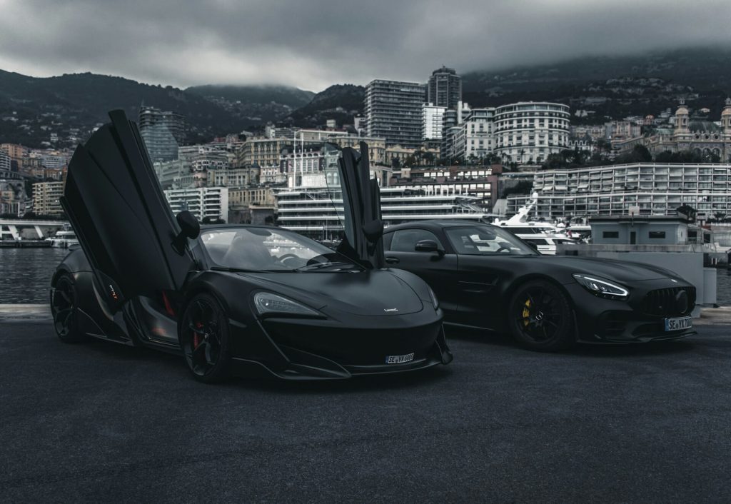 black supercars by harbor